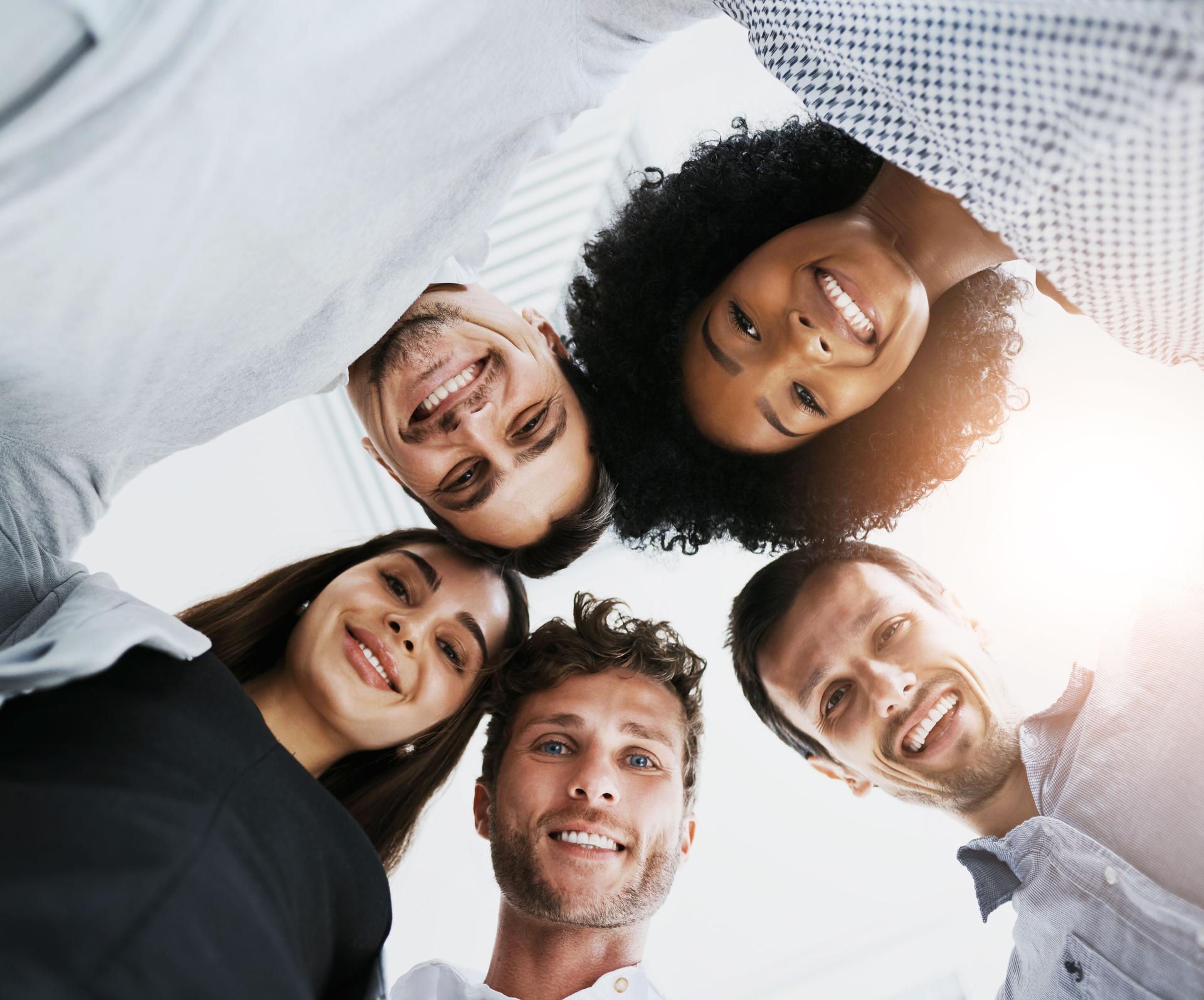 Office, circle and portrait of business people for teamwork, collaboration and solidarity for about us. Corporate staff, diversity and low angle of workers for support, community and company pride